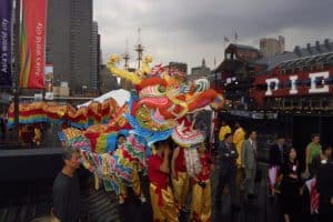 A Chinese dragon dance troupe performs at the South Street Seaport dock during the Circle Line ferry christening, September 10, 2001, photographed by Jack Hartzman.